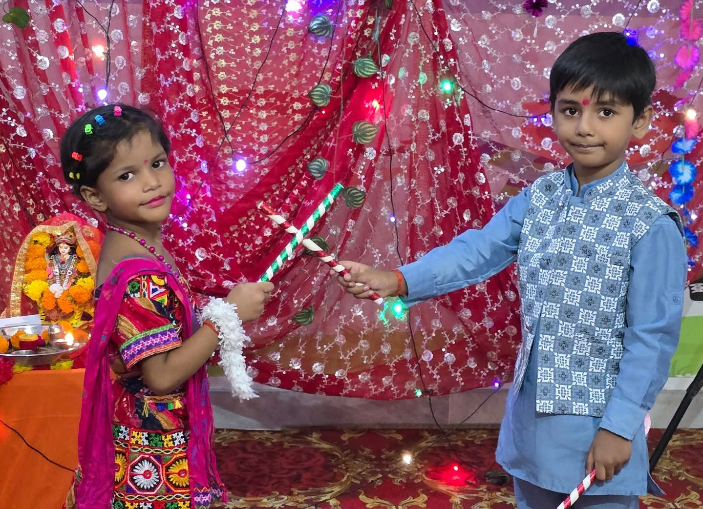 Playing dandiya at our Janmashtami celebration