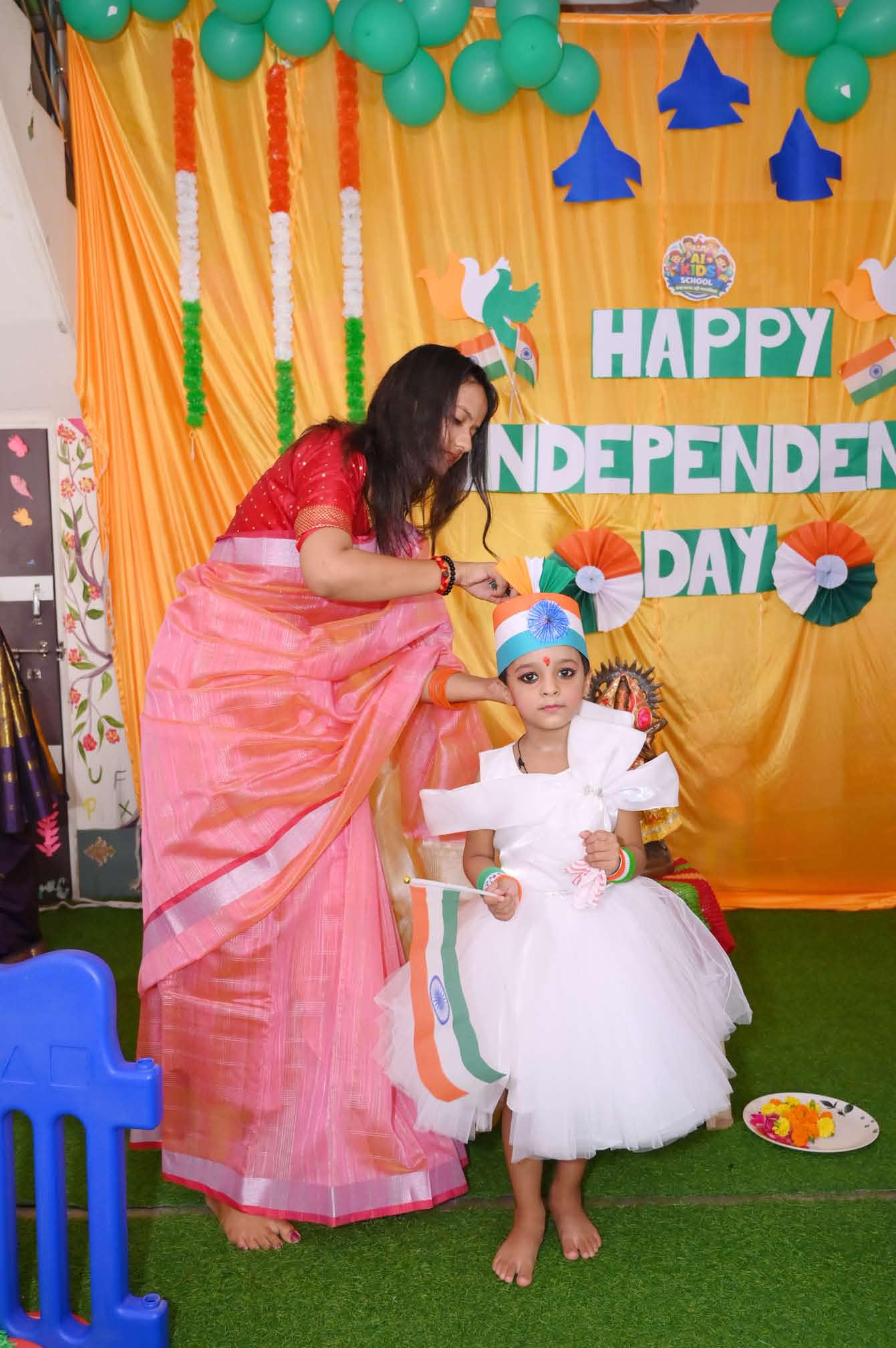 A teacher settling one of our smallest students