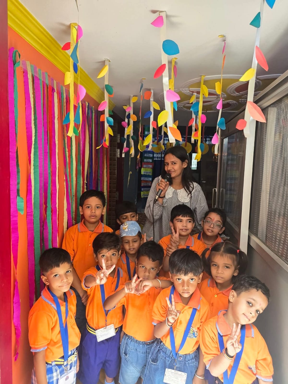 Children in uniform in a decorated school corridor